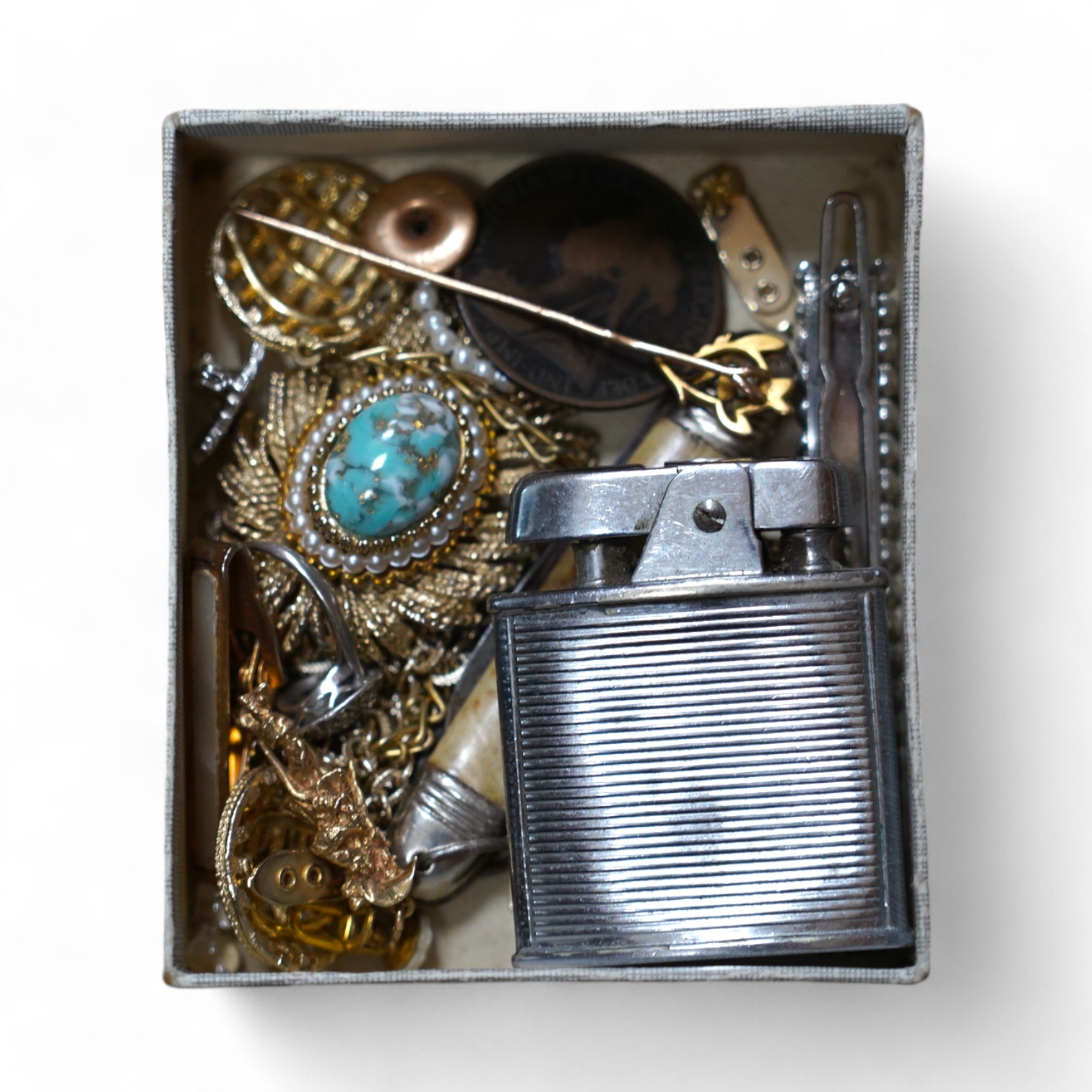 Assorted jewellery and other items including a 1970's 9ct gold Cavalier charm, 30mm, 5.9 grams, a 14k tram charm, 1.7 grams, a 9ct and enamel Esso badge, a yellow metal stick pin, marcasite and costume, lighter penknife,